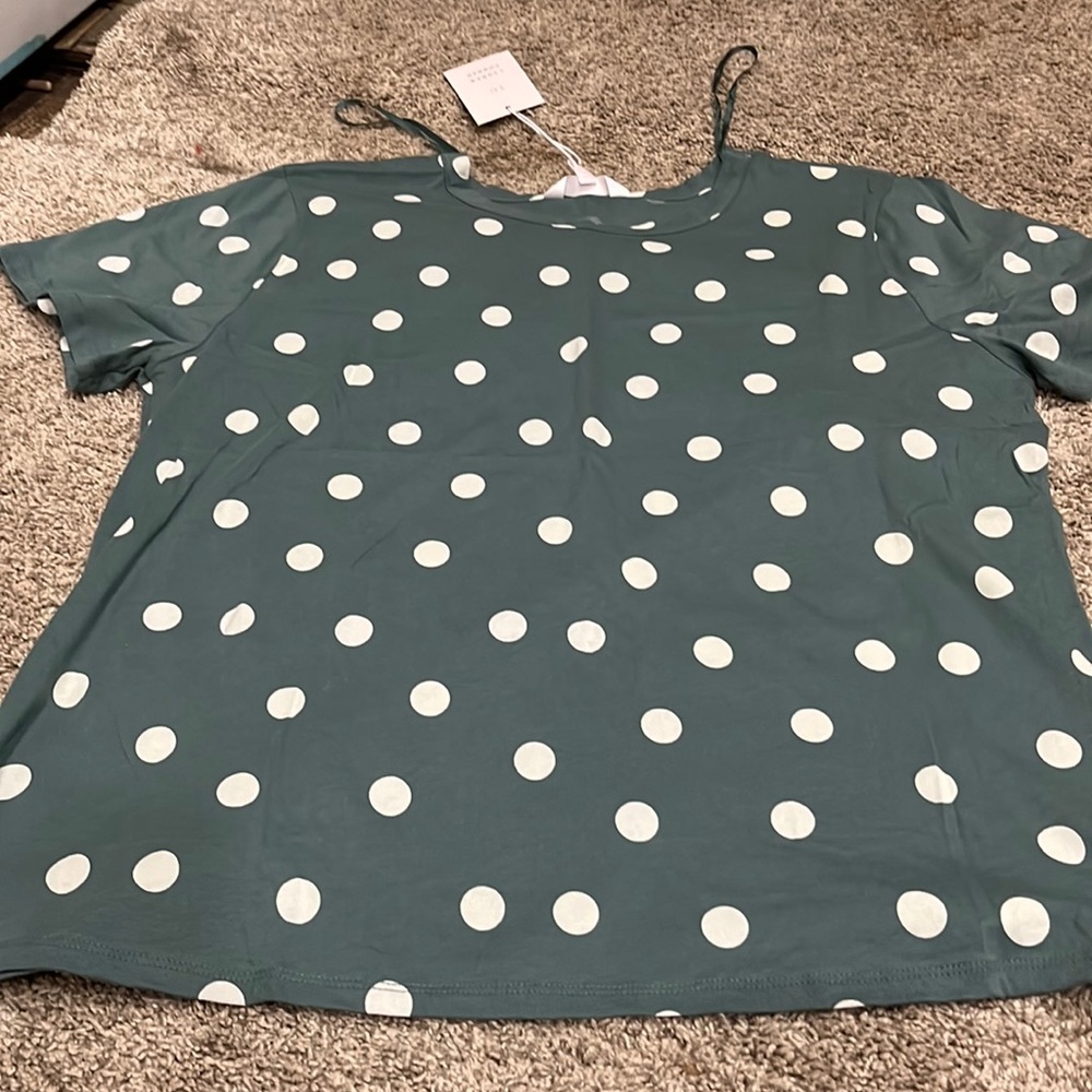 Green polka dots T-shirt.